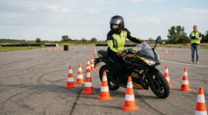 Motorcyclist practicing emergency braking during rider training